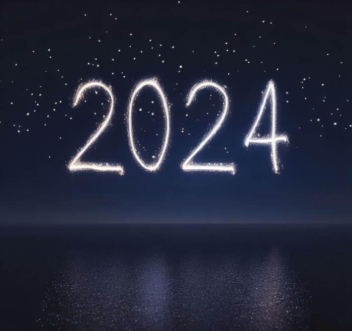 Dunkler Himmel mit Zahl 2024 und Spiegelung auf dem Meer